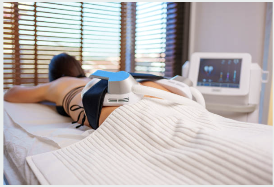 Woman undergoing non-invasive body sculpting treatment with HIFEM technology on glutes